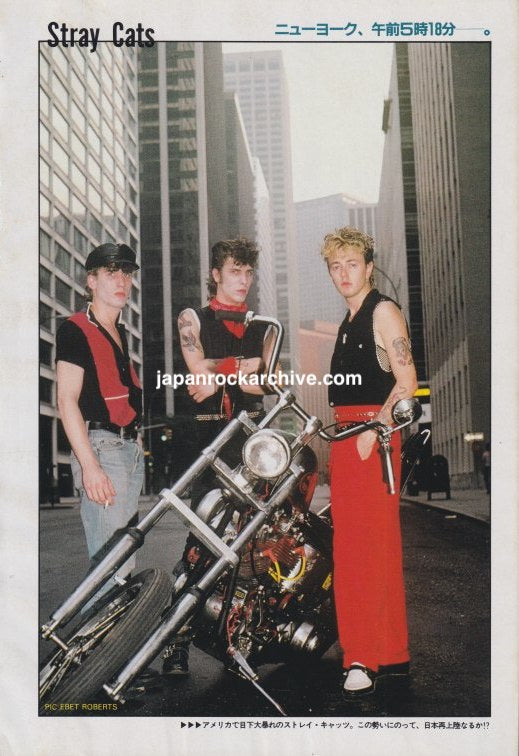 Stray Cats color Japanese magazine pinup beside a motorcycle, May 1983