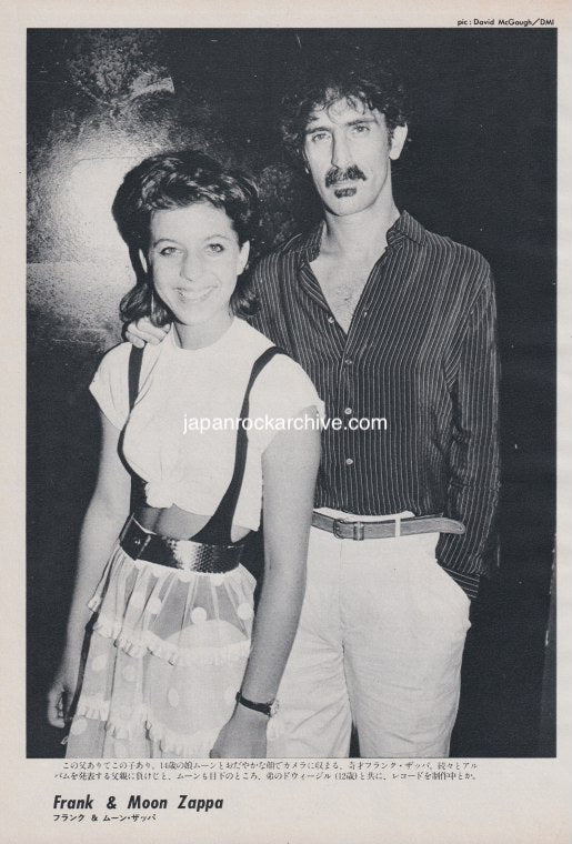 Black and white magazine photo pinup of Frank Zappa and Moon Unit Zappa